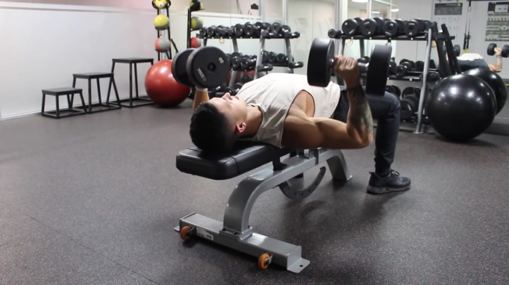 Dumbbell bench press for greater range of motion