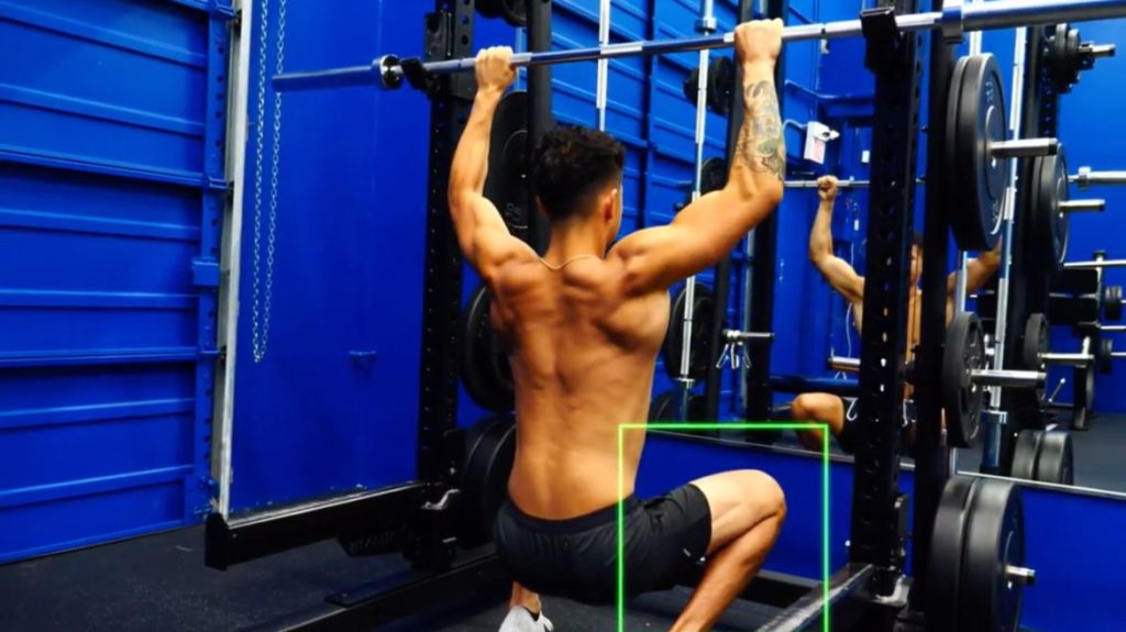 Use a barbell if you don't have access to a cable machine for a kneeling pull down exercise